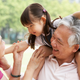 Image of happy but probably busy grandparents via Shutterstock.